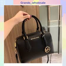 M K Sling Duffle Hand Bags