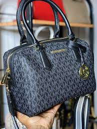 M K Sling Duffle Hand Bags