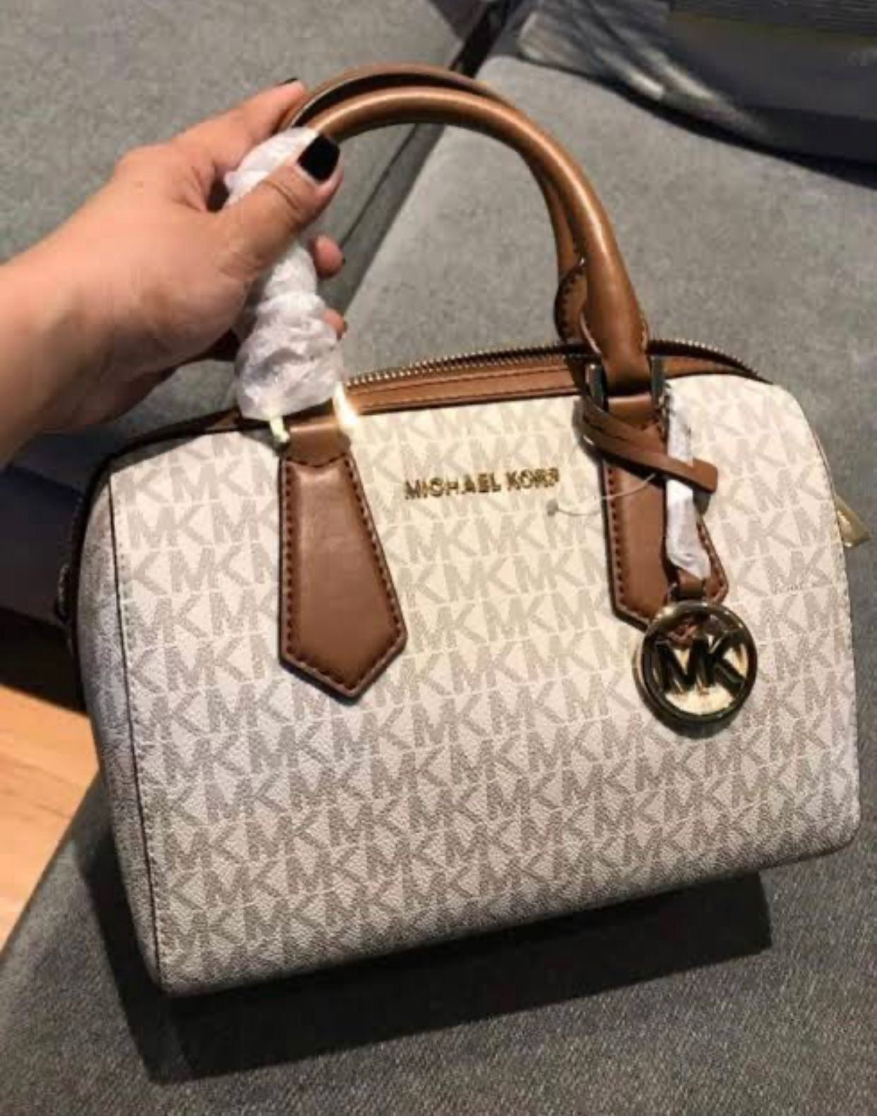 M K Sling Duffle Hand Bags