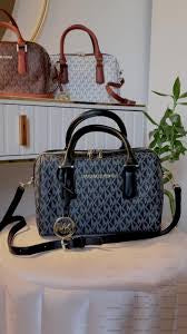 M K Sling Duffle Hand Bags