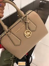 M K Sling Duffle Hand Bags