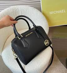 M K Sling Duffle Hand Bags